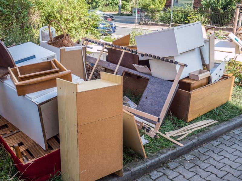 bulky rubbish in driveway requiring a skip